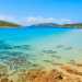 Spiaggia di Tuerredda  Larenile si trova in una insenatura tra capo Malfatano e capo Spartivento, nella parte meridionale della Sardegna. Ben riparata dal vento maestrale permette bagni di sole e di mare in una cornice da sogno